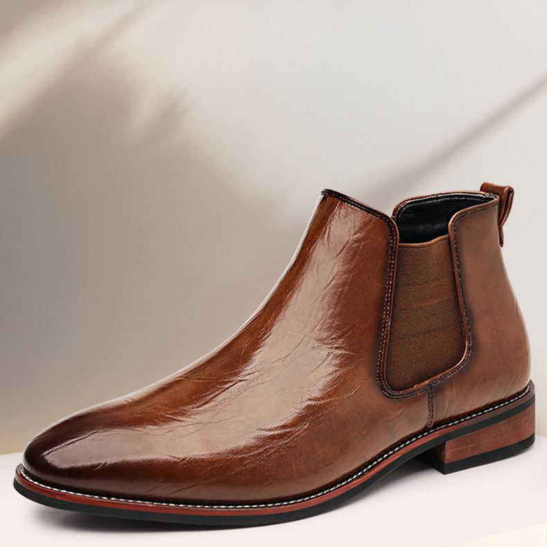 Side view of men's sleek black slip-on ankle boots, ideal for smart casual or formal outfits.