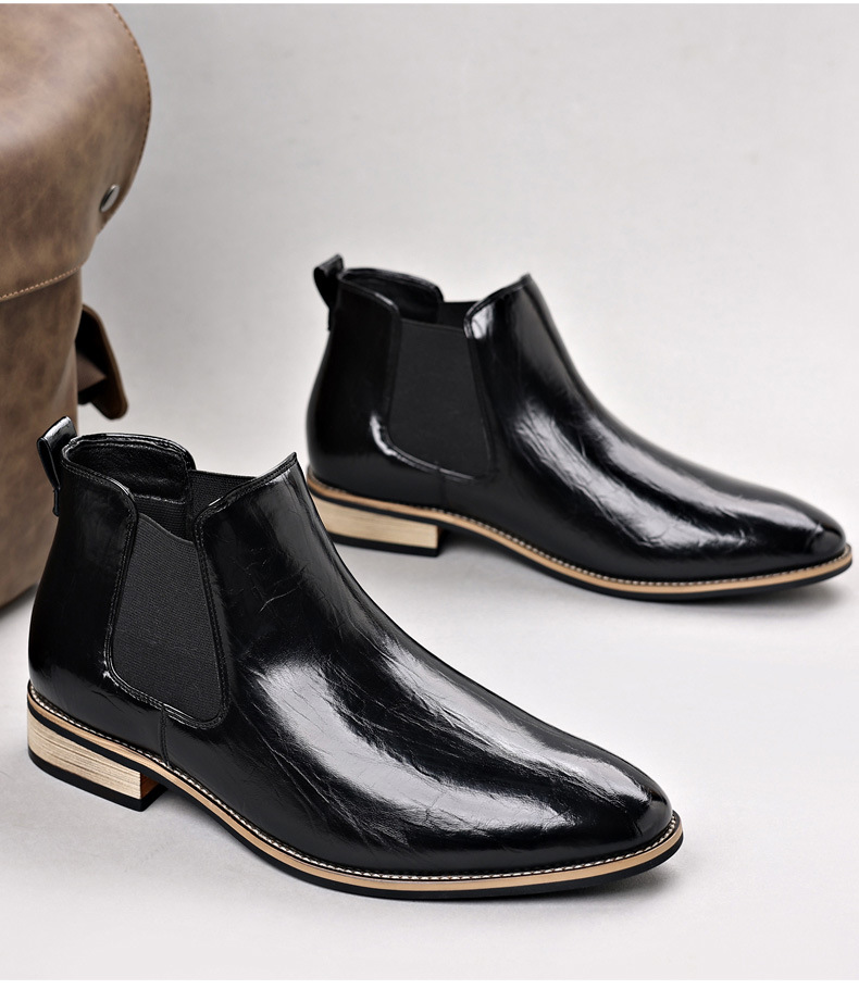 Pair of classic men's black polished Chelsea boots, versatile men's footwear for any occasion.