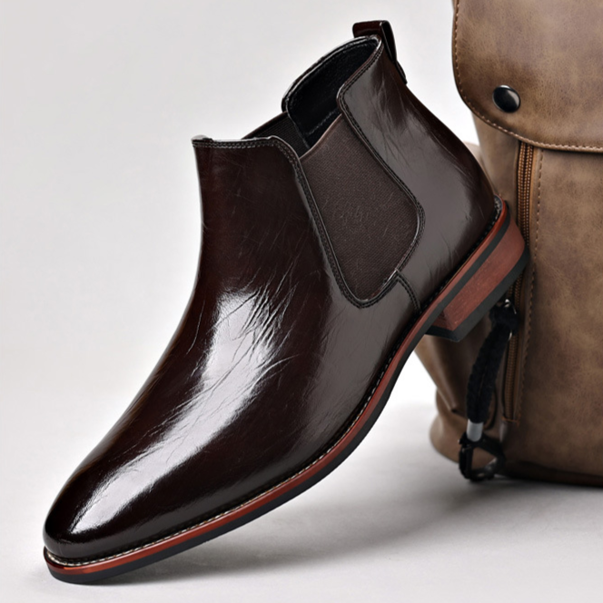 Comfortable men's polished leather Chelsea boots, suitable for both office and casual settings.