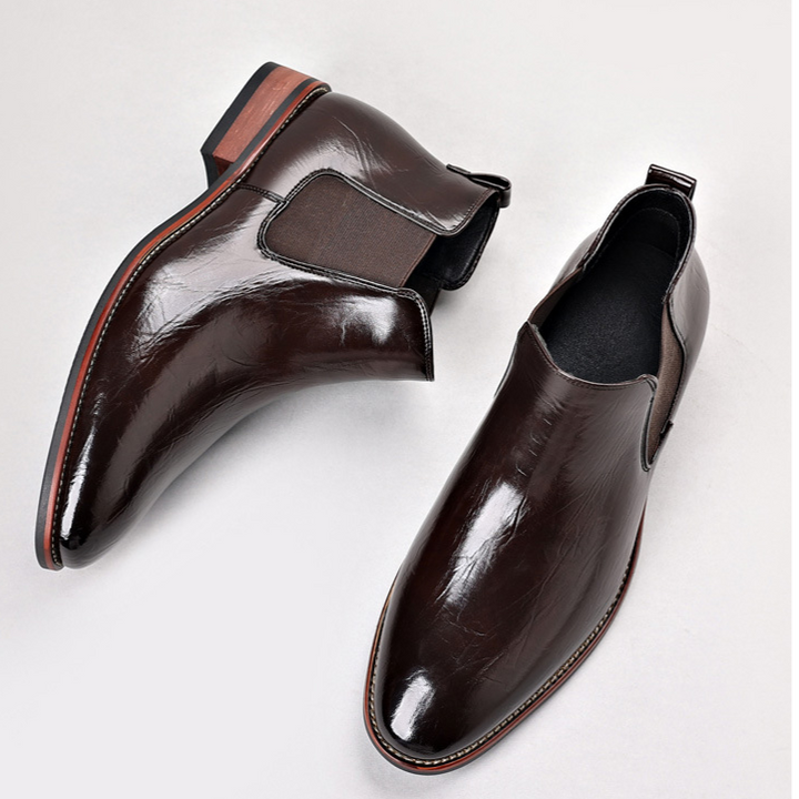 Men's premium brown Chelsea boots, showcasing their polished look and easy slip-on design.