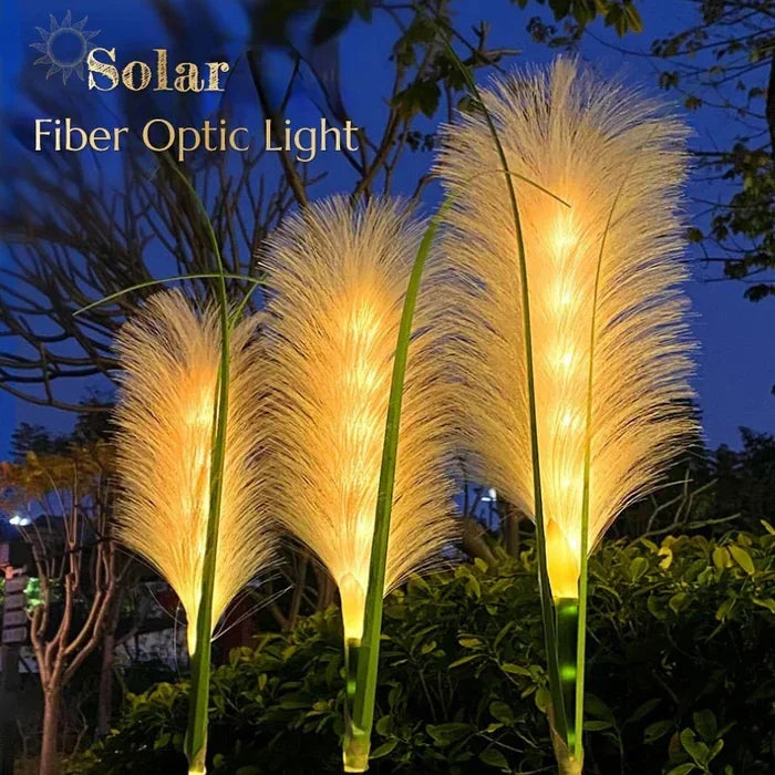 Set of waterproof reed-style solar lights enhancing garden landscape design.