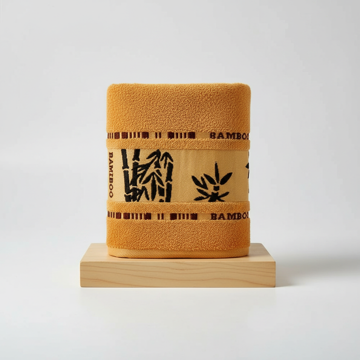 Folded Unisex Bamboo Towel Set in a neutral bathroom setting, emphasizing sustainable and eco-friendly home decor.