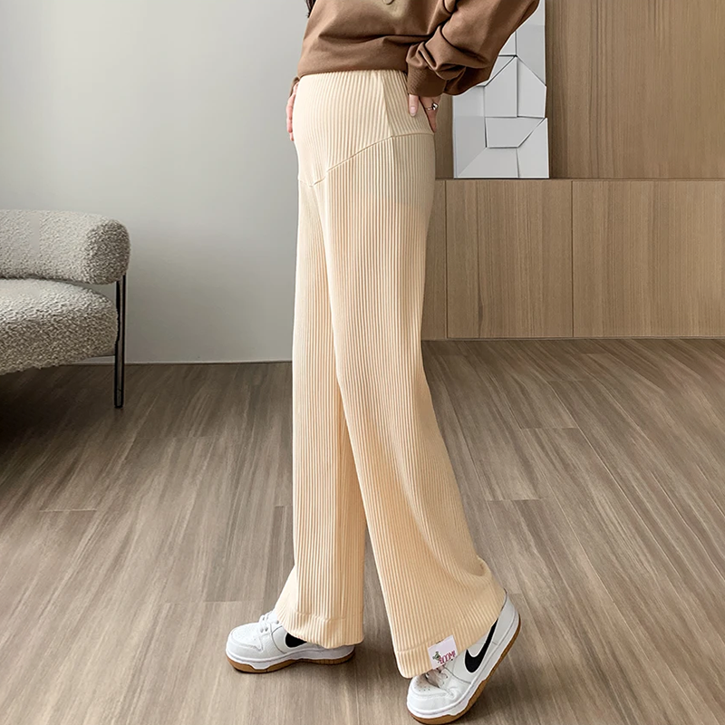 Stylish beige maternity pants for women, offering comfortable & stretchy support for expectant mothers.