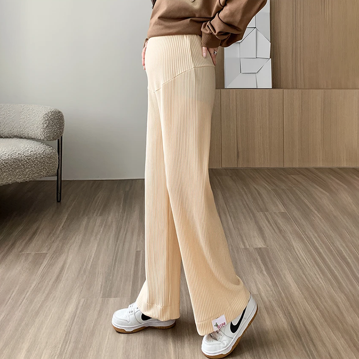 Stylish beige maternity pants for women, offering comfortable & stretchy support for expectant mothers.