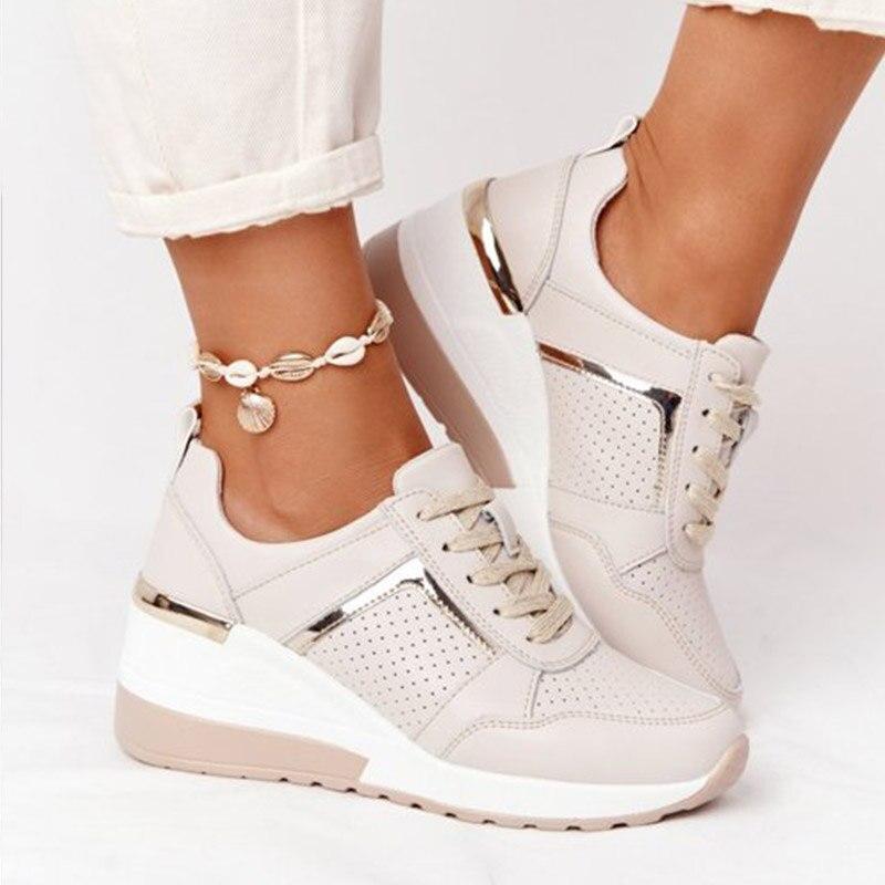 Close-up of stylish women's orthopaedic sneakers, offering arch support & all-day comfort.