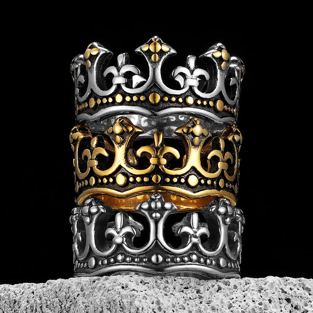 Close-up: Unisex stainless steel crown ring, detailed royal emblem.