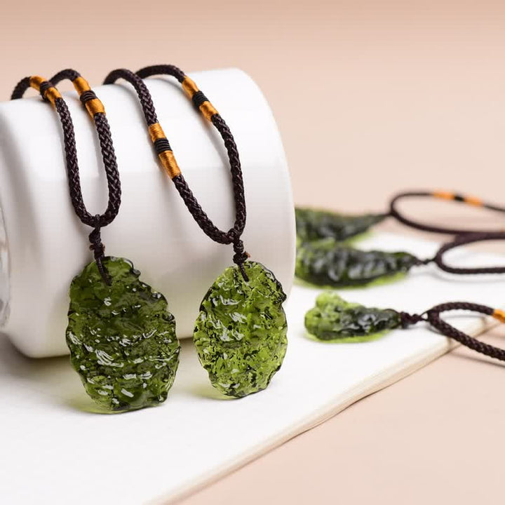 Green Moldavite pendant on a chain, women's spiritual healing gemstone necklace for transformation.