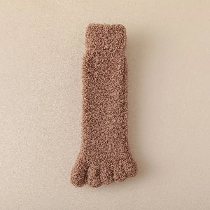Soft knitted women's cozy toe socks, ideal for winter comfort and home wear.