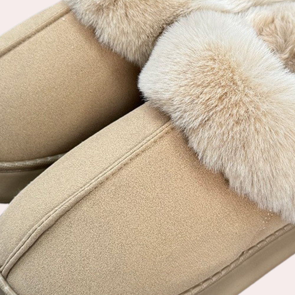 Fluffy women's house slippers with a soft plush lining. Perfect for warm winter comfort & relaxation.