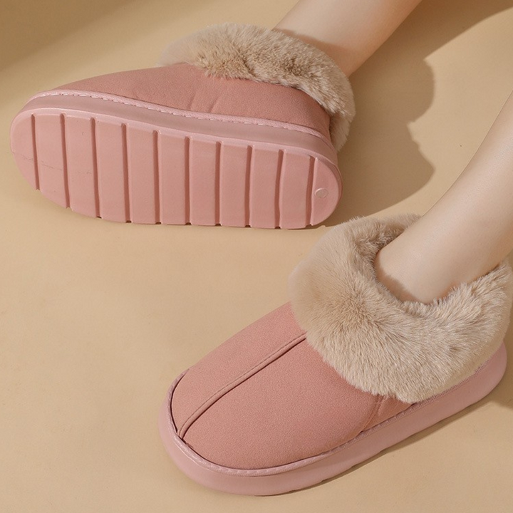 Women's warm house slippers featuring a non-slip sole for secure indoor comfort. Cloud-soft & plush design.