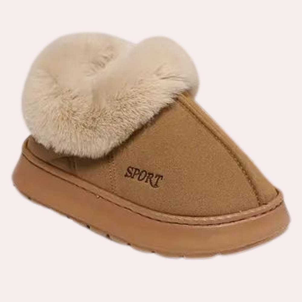 Close-up of cloud-soft women's warm slippers. Plush lining ensures cozy indoor comfort & warm feet.