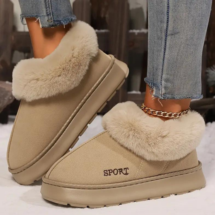 Women's cloud-soft warm house slippers with a plush lining & non-slip sole. Cozy indoor comfort footwear.