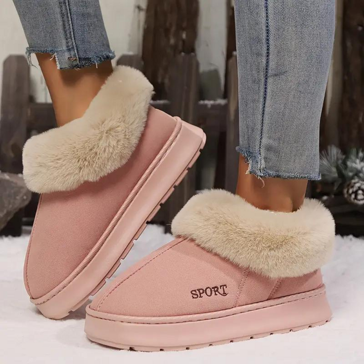 A pair of women's cloud-soft warm slippers, providing cozy indoor comfort & warmth. Ideal house shoes.