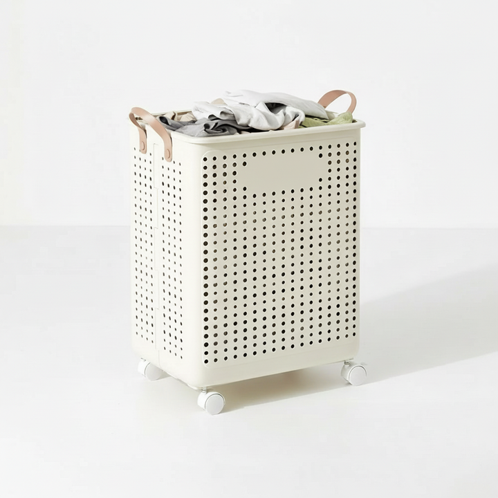 Wheeled laundry hamper, Collapsible Rolling Laundry Basket, folded flat, next to a washing machine.
