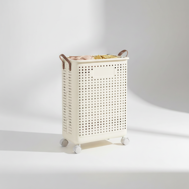Detail shot of a breathable fabric collapsible laundry basket with durable wheels and handle.