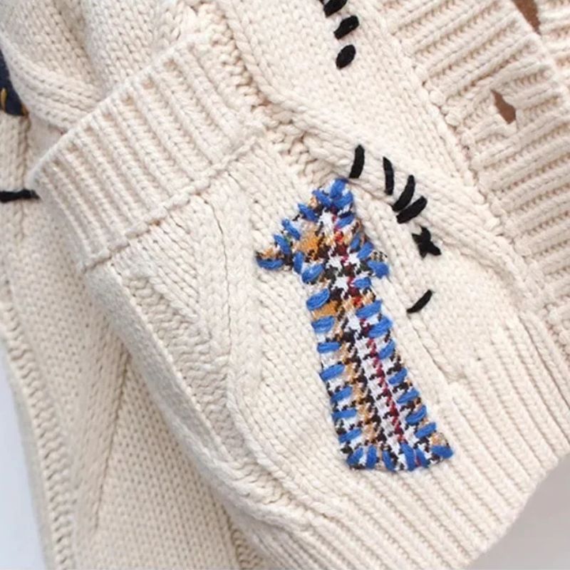 Vibrant, colorful women's Patcha cardigan featuring a unique, expressive pattern. Cozy, stylish outerwear for fall & winter.
