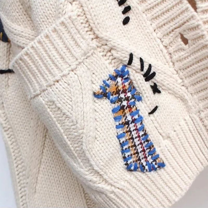 Vibrant, colorful women's Patcha cardigan featuring a unique, expressive pattern. Cozy, stylish outerwear for fall & winter.