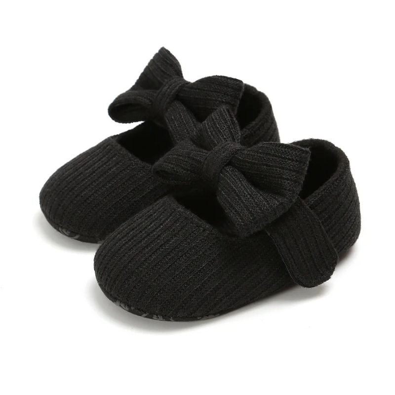 Infant crawling shoes with soft, protective sole, offering comfort & secure fit for baby's little adventures.
