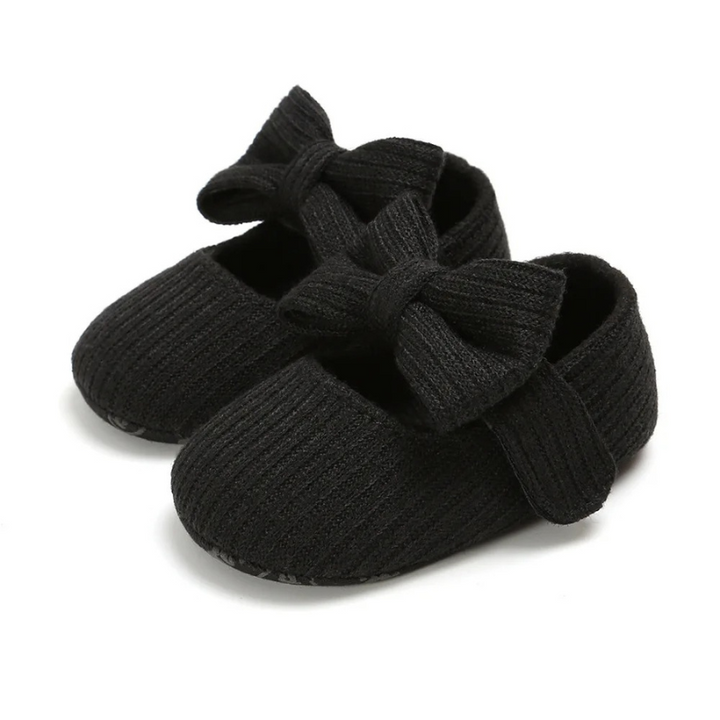 Infant crawling shoes with soft, protective sole, offering comfort & secure fit for baby's little adventures.