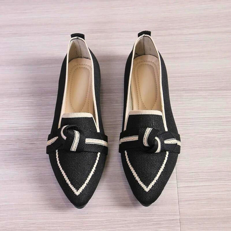 Comfortable beige ballet flats for women, perfect everyday footwear with a twisted toe and slip-on design.