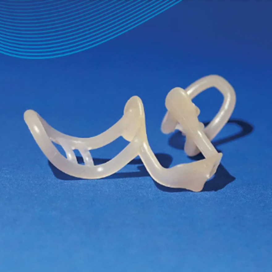 Nasal dilator anti-snoring device provides snoring relief and comfortable breathing aid.