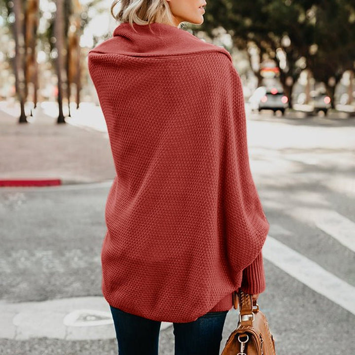 Soft-knit oversized women's cardigan, a comfortable & stylish wrap for ladies' casual layering.