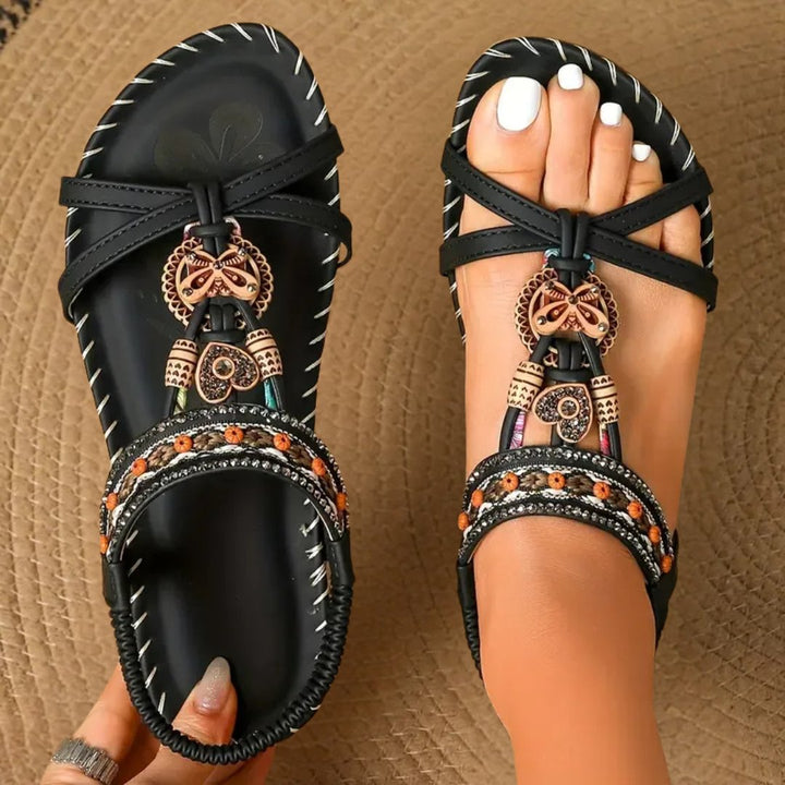 Orthopedic women's flat T-strap sandals designed for all-day comfort. Essential summer footwear for health.