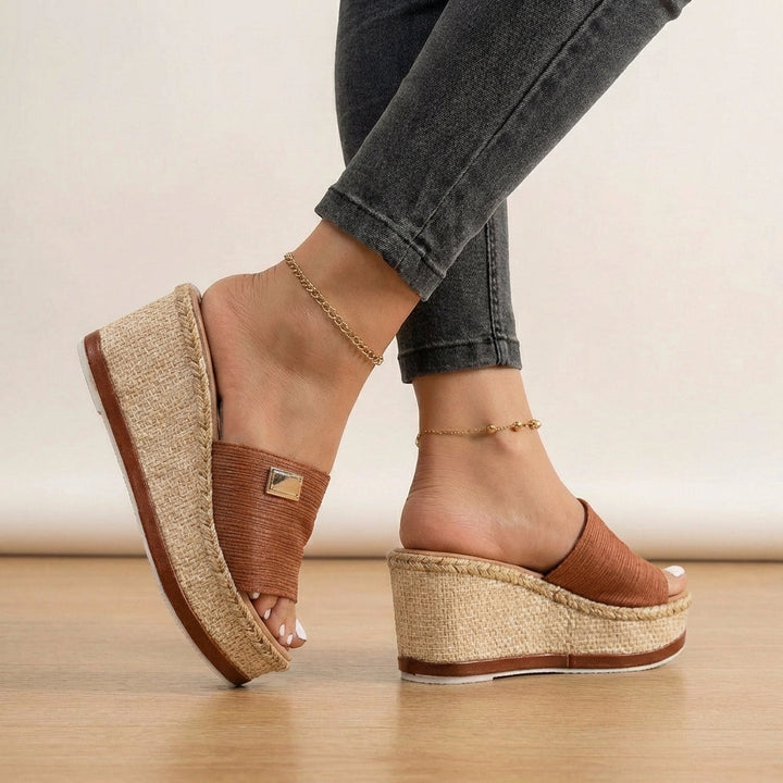 Women's platform espadrille sandals with an open-toe design and elegant textured strap, ideal for summer.