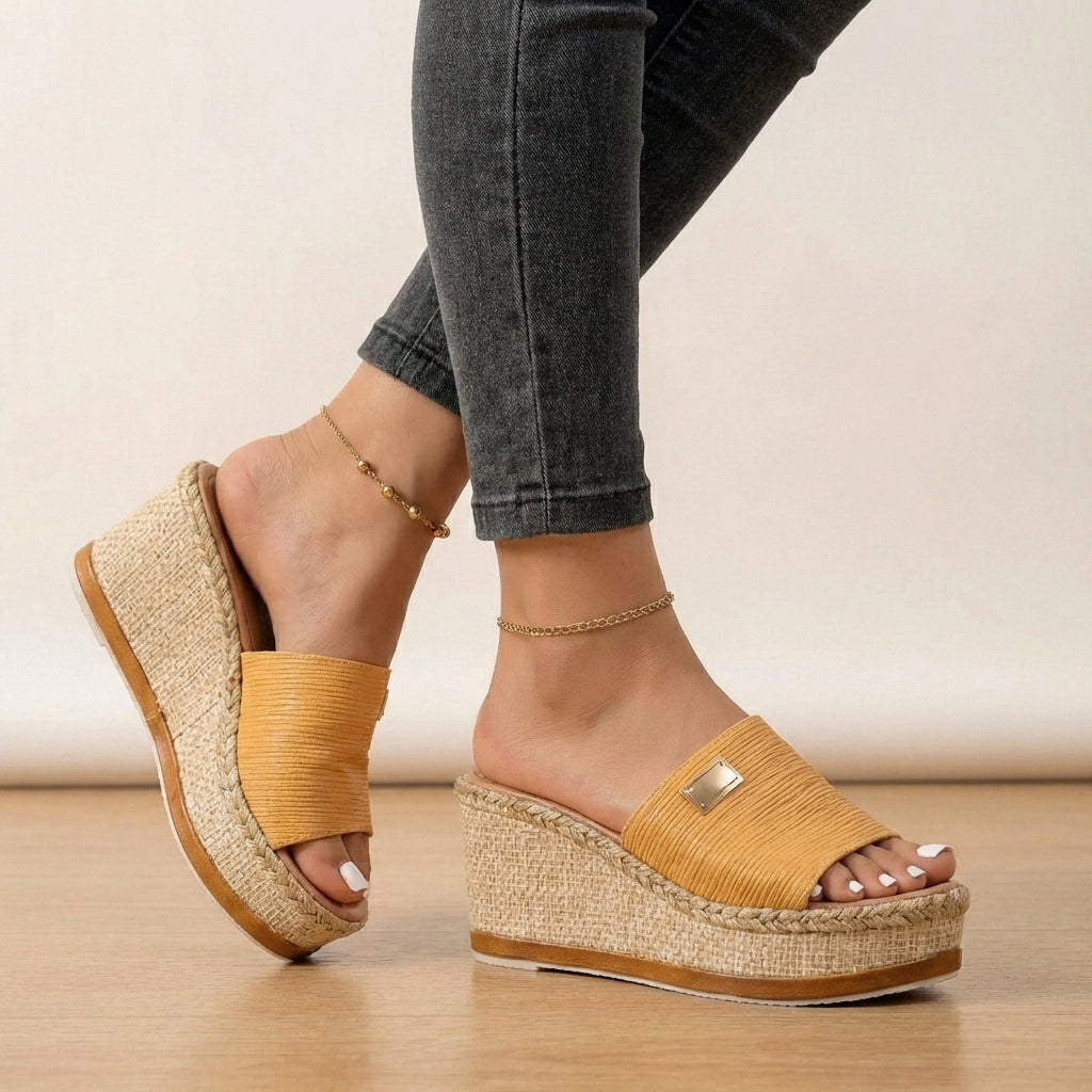 Stylish women's summer espadrille wedge sandals, designed for comfort with a chic textured strap detail.