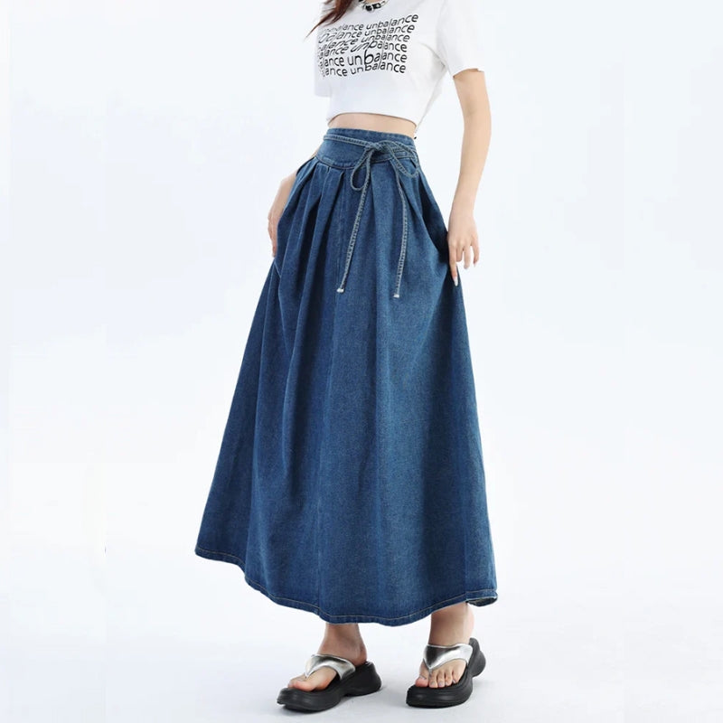 Comfortable women's everyday denim midi skirt with elastic waist, perfect for casual, versatile wear. Blue wash.