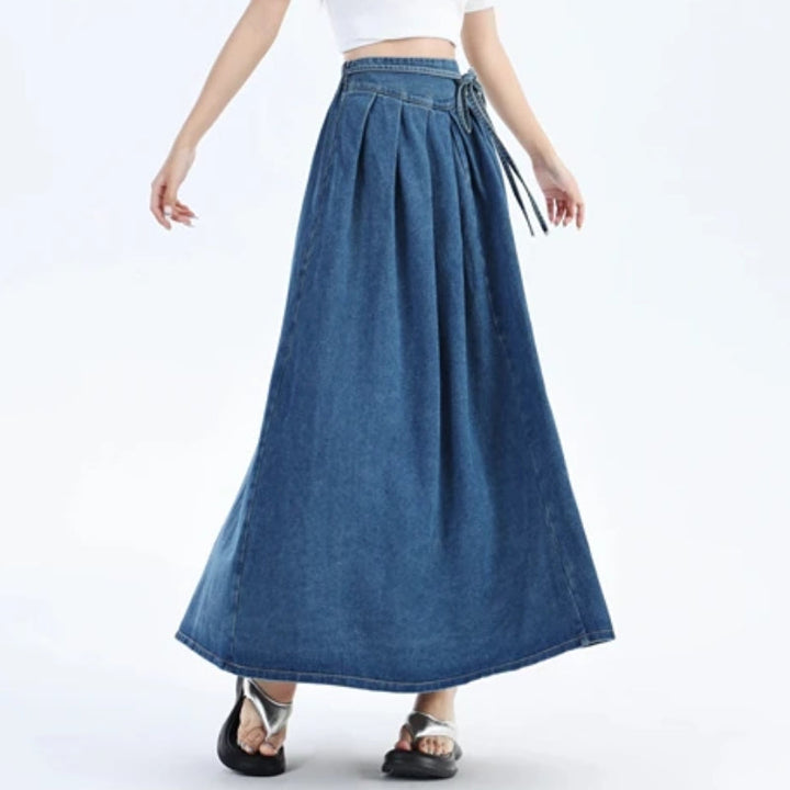 Light blue denim midi skirt for women, featuring an elastic waist for comfortable, casual everyday fashion.