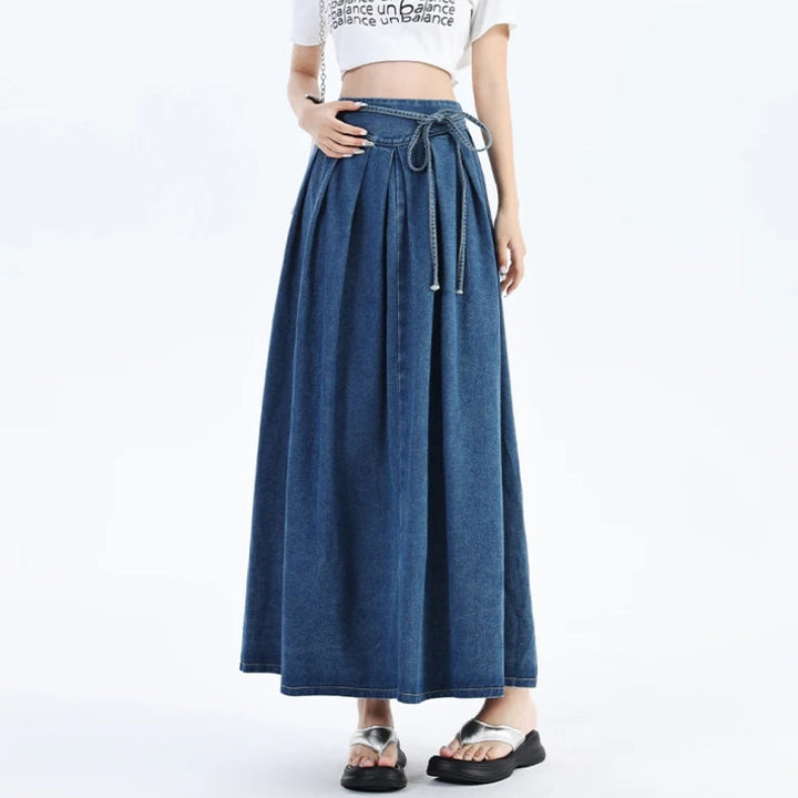 Versatile women's midi denim skirt. Elastic waist ensures a comfortable fit for everyday casual style. Blue.