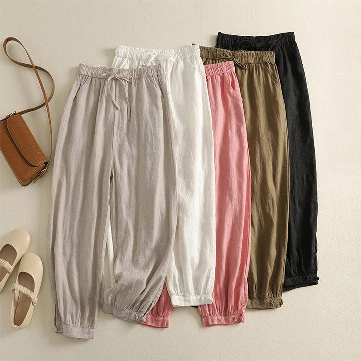 Relaxed fit beige women's harem pants, supremely comfortable with elastic waist & fashionable tapered design. Summer ready!