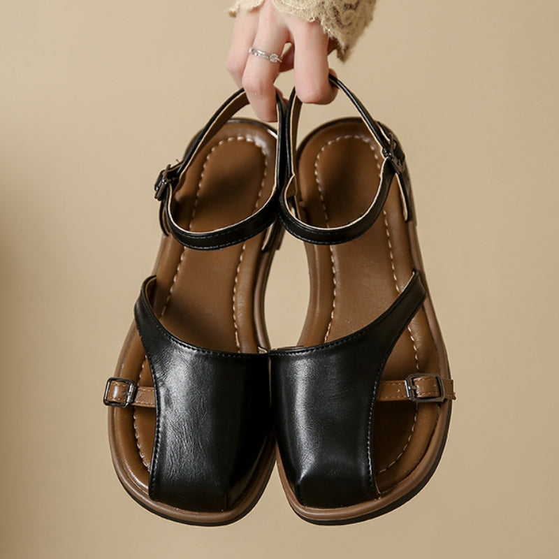 Stylish women's ballet flats with modern square toe and chic ankle strap, offering comfortable, versatile footwear.
