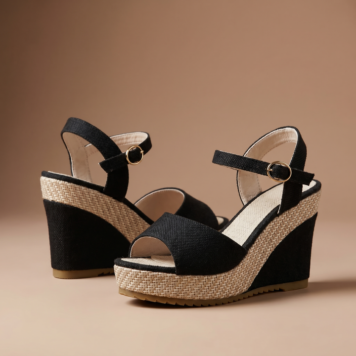 Modern women's wedge heels, featuring a comfortable ankle strap, suitable for elegant spring fashion.