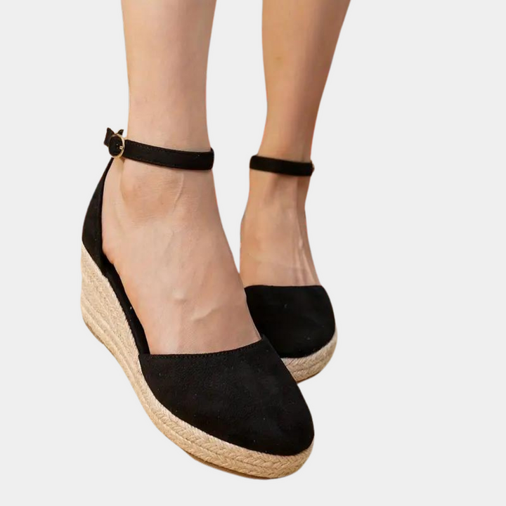 Comfortable women's wedge heels with adjustable ankle strap, versatile for elegant summer fashion & office.