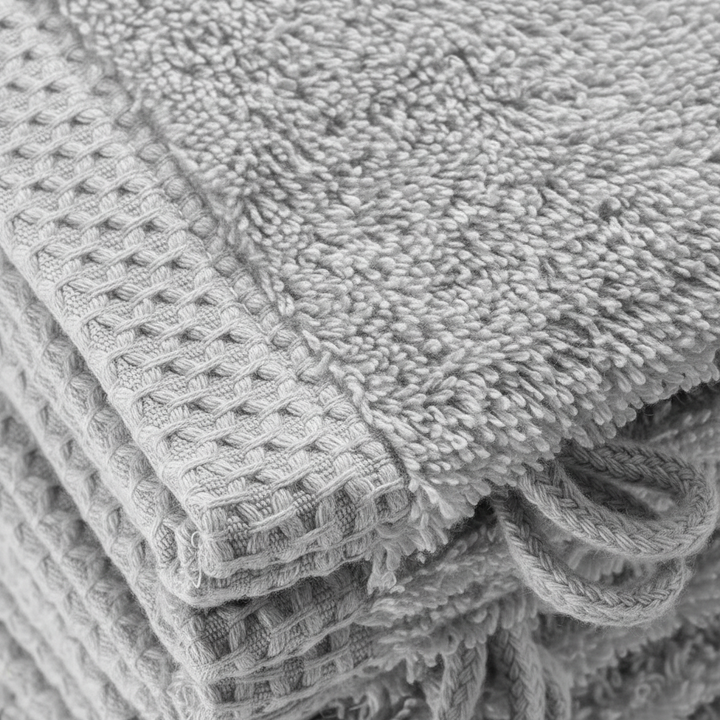 Close-up of a textured ComfortGlove premium organic cotton washcloth, highlighting its soft and absorbent quality.