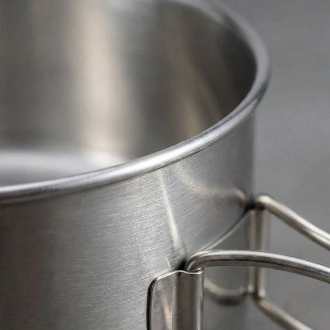Durable aluminum camping pot from an 8-piece cook set, essential hiking gear for outdoor meals.