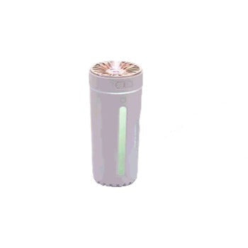 Glowing mist from a portable USB humidifier, offering quiet operation & improved ambient air in any setting.