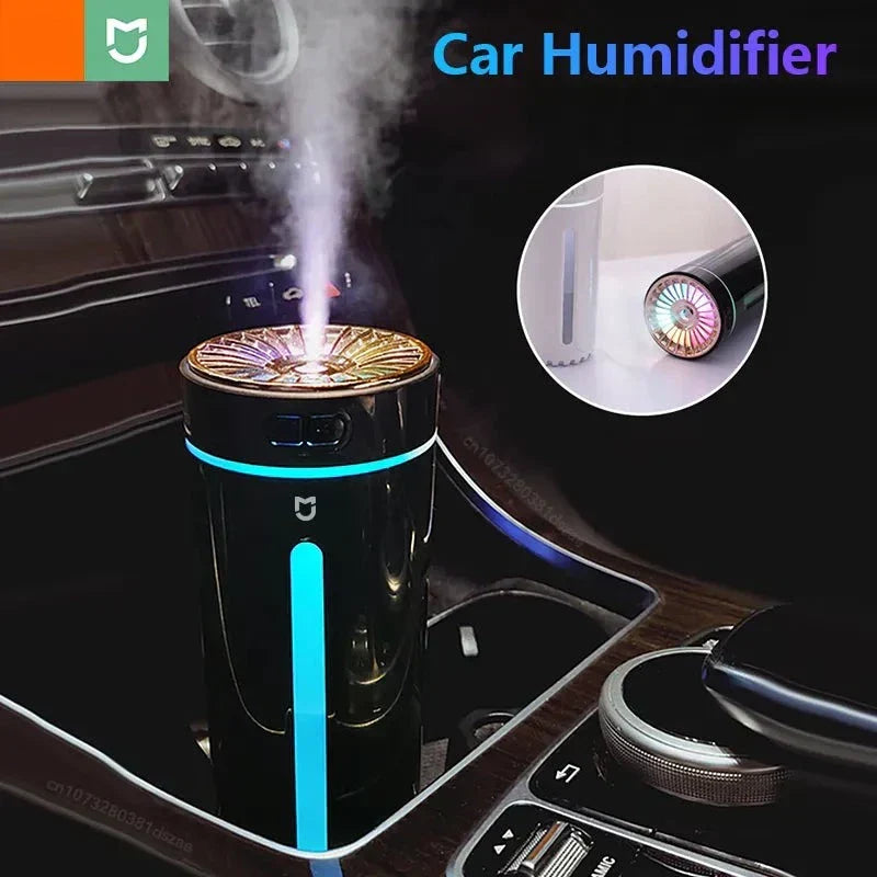 White portable USB humidifier on an office desk, quietly improving air quality for a productive workspace.