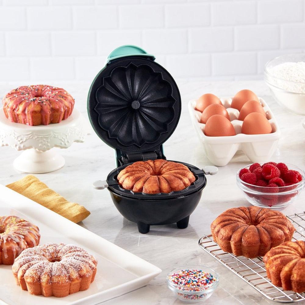 Compact BakeEase electric cake maker, perfect for quick, easy home baking. Non-stick surface.