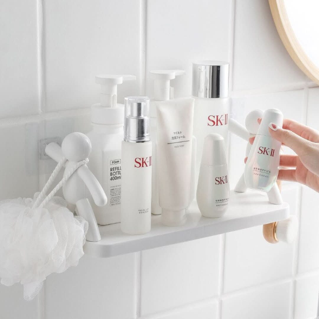 Compact white bathroom wall organizer with a cheerful, playful design for small baths