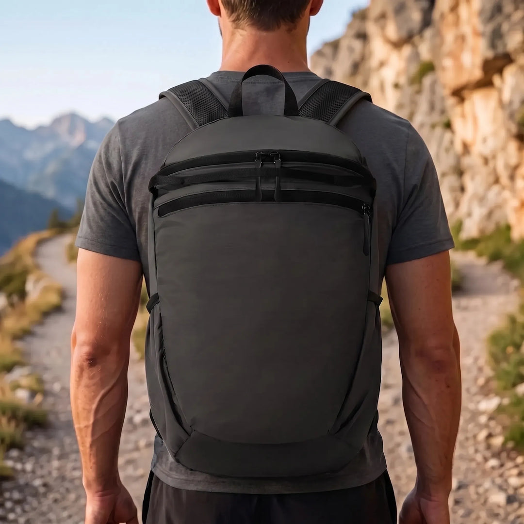 Compact black foldable travel daypack backpack for men & women, ideal for space-saving trips & excursions.