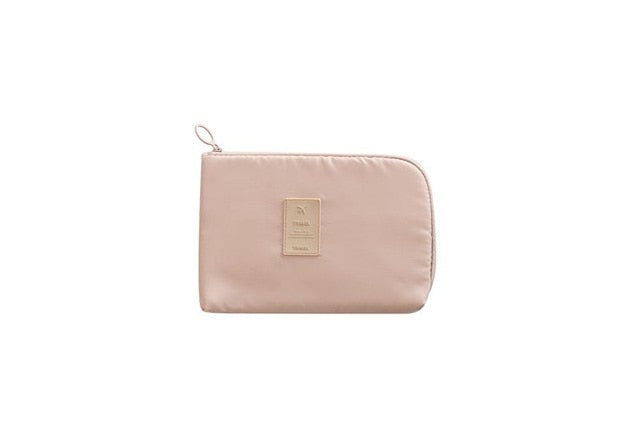 Compact cactus waterproof travel organizer for electronics and cables.