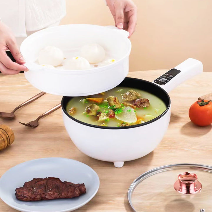 Compact electric frying pan & steamer for healthy multi-cooker meals. Non-stick surface, ideal kitchen appliance.