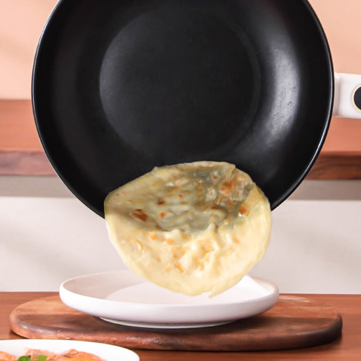 Multi-use electric frying pan & steamer preparing a healthy meal. Ideal kitchen appliance for meal prep.
