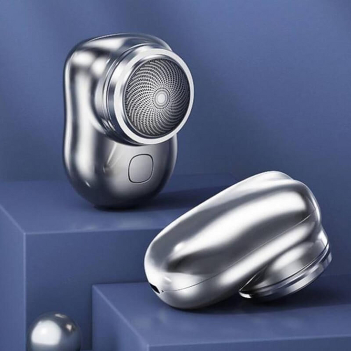 Compact electric mini shaver for men's travel grooming, offering smooth wet/dry shaves.