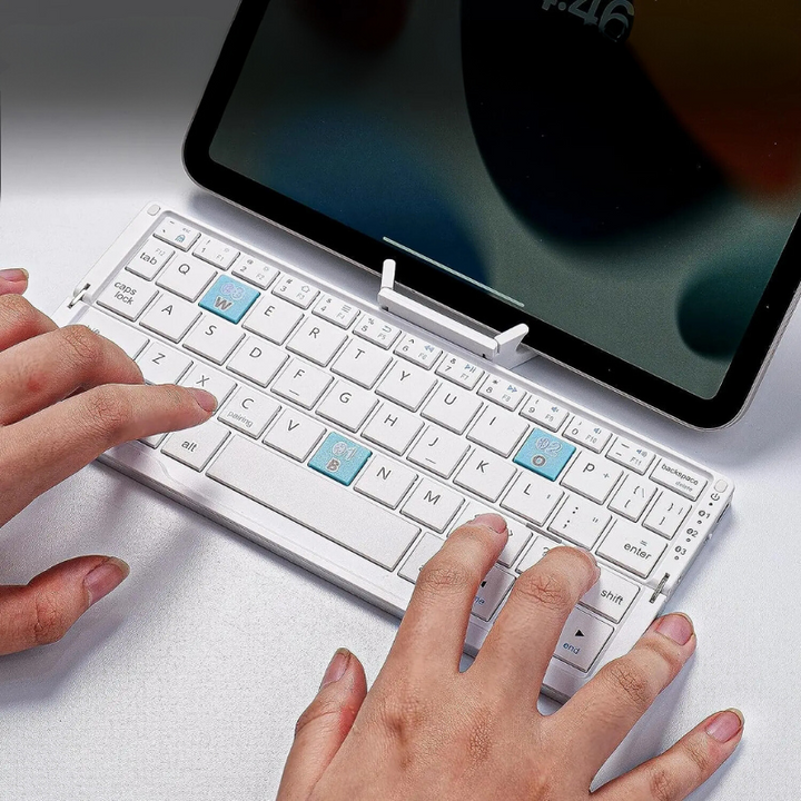 Compact foldable Bluetooth keyboard for tablets & smartphones. Portable wireless typing for iPad & Android devices.