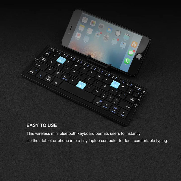Folded portable Bluetooth keyboard, sleek aluminum design. Ideal compact wireless accessory for travel & mobile.