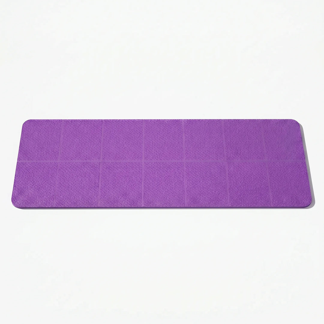 Foldable travel yoga mat in a neat stack, ideal for easy portability & storage. Non-slip TPE for all exercises.